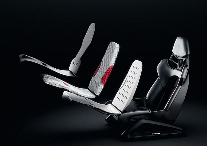 The 3D-printed bodyform full-bucket seat concept study is a modular structure with individual layers (full-bucket seat, base substrate, 3D-printed comfort layer, perforated Racetex cover)