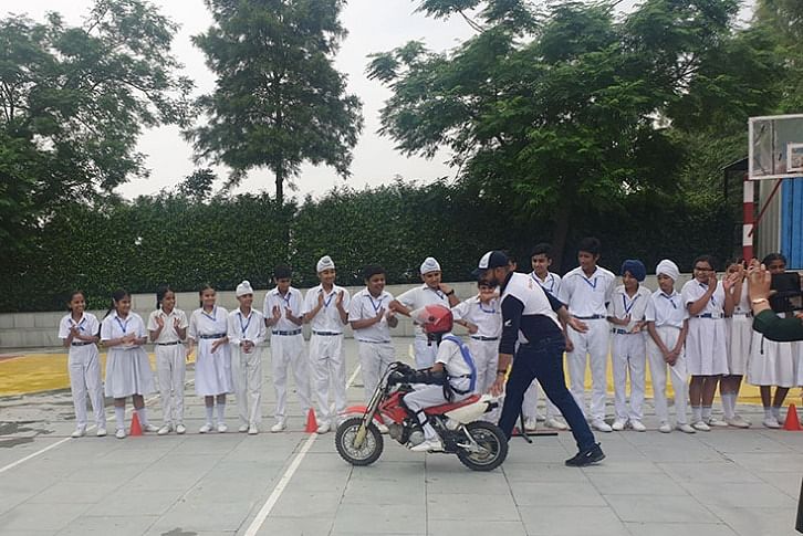 A student learns safe riding techniques on HMSI&#39;s imported CRF50 motorcycle.