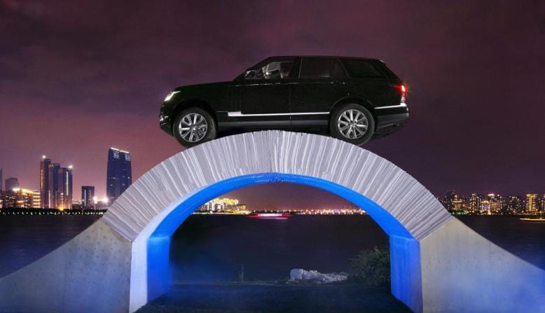Land Rover celebrates 45th anniversary by driving Range Rover SUV over a paper bridge