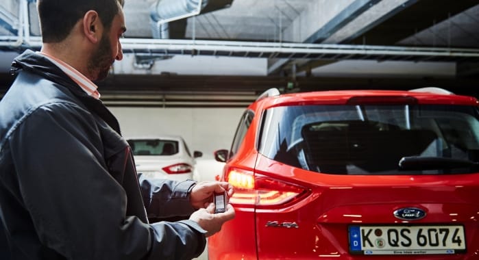 Remote parking helps people get out of a car after parking in a tight space