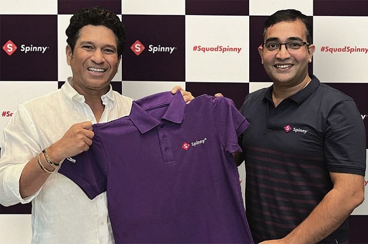 Sachin Tendulkae with Niraj Singh, founder and CEO of Spinny, the used car platform.